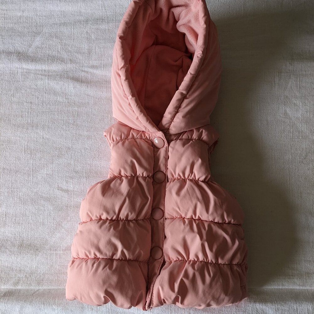 Pink puffer vest with bow
